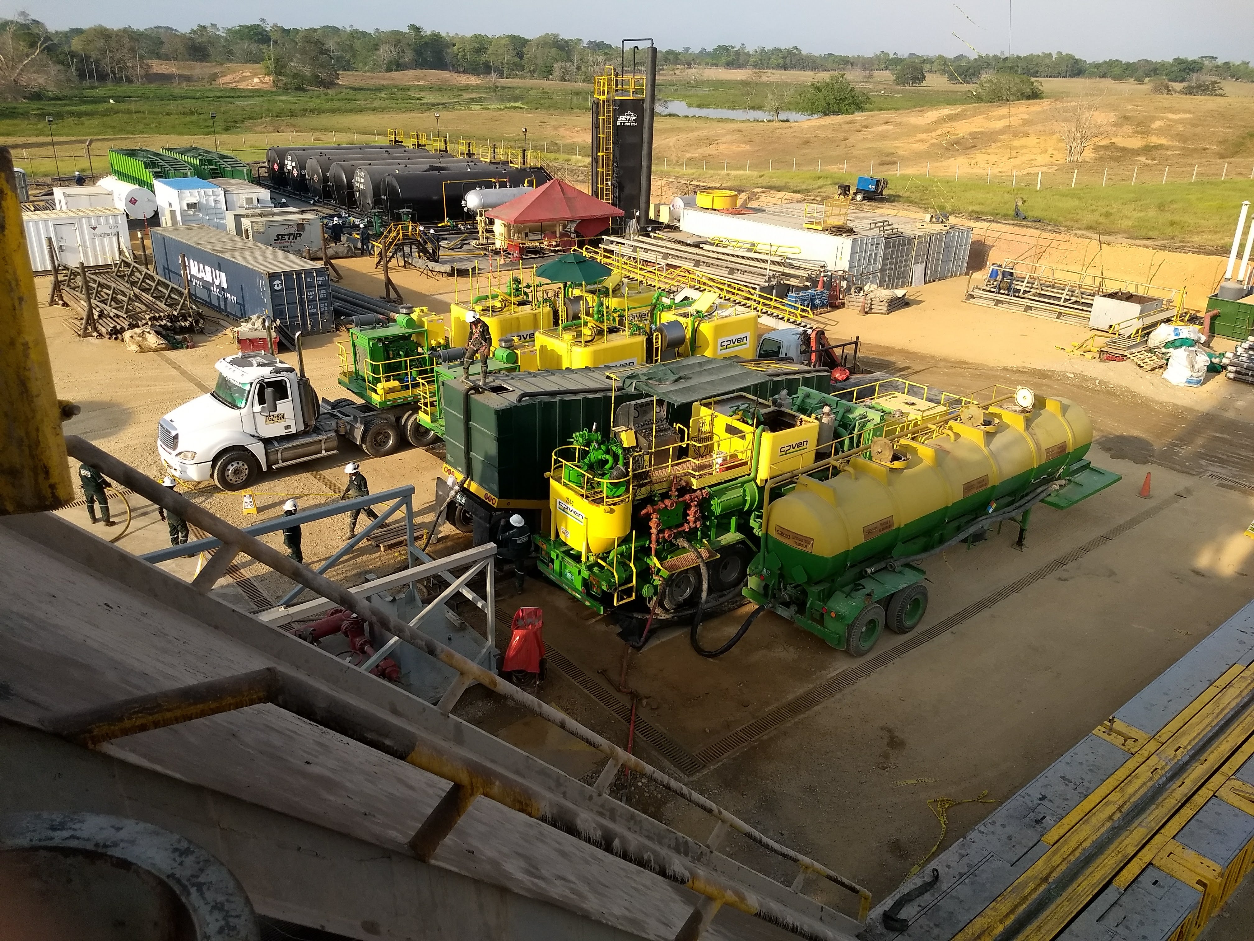 Oil field with industrial equipment